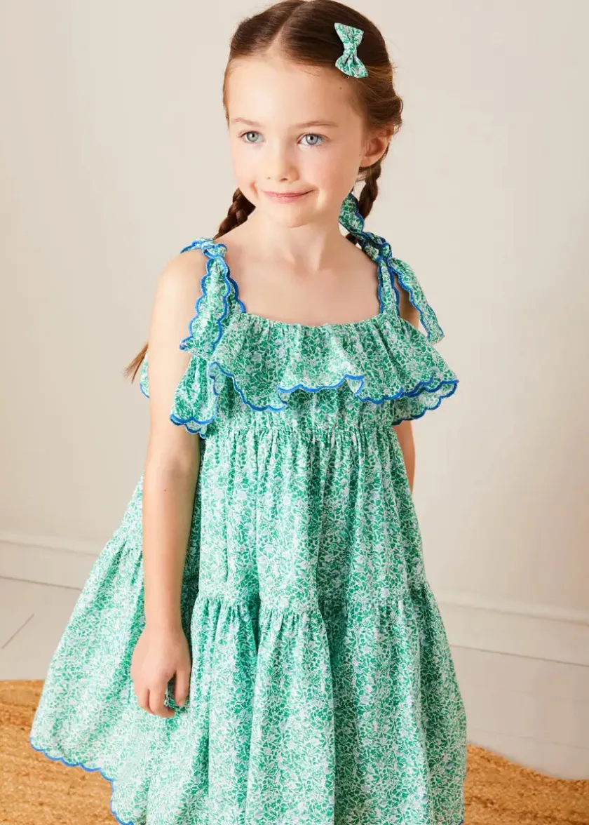 Lookbooks | Pepa London Adelaide Floral Tiered Tie Strap Dress in Green (4-12yrs) | Plain Cardigan in Navy (6mths-10yrs) | Metallic Strappy Leather Sandals in Gold (24-35EU) | Adelaide Floral Detail Raffia Bag in Green | Adelaide Floral Small Bow Hair Clip in Green