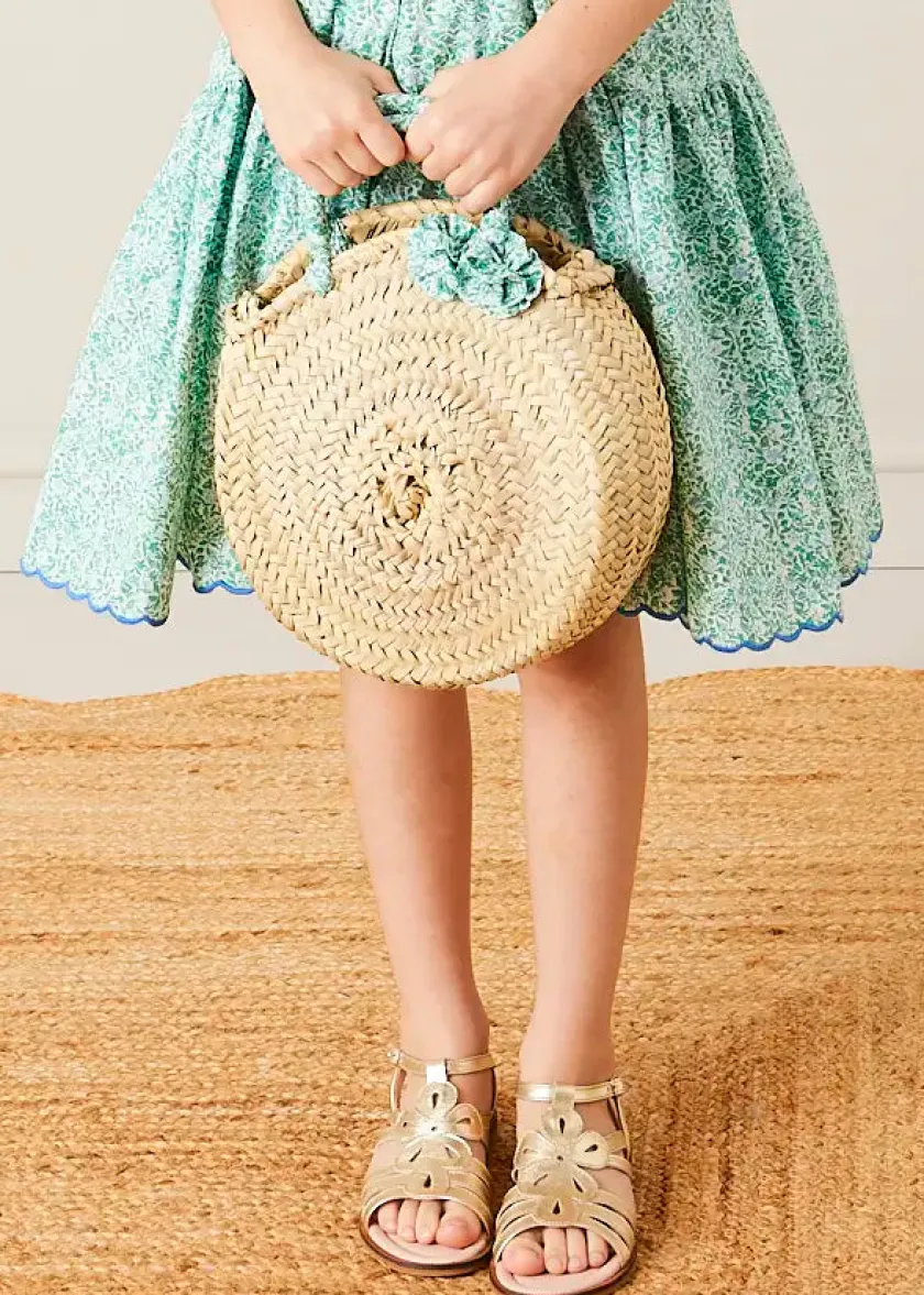 Lookbooks | Pepa London Adelaide Floral Tiered Tie Strap Dress in Green (4-12yrs) | Plain Cardigan in Navy (6mths-10yrs) | Metallic Strappy Leather Sandals in Gold (24-35EU) | Adelaide Floral Detail Raffia Bag in Green | Adelaide Floral Small Bow Hair Clip in Green