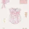 Lookbooks | Pepa London Audrey Hand Smocked Double Breasted Short Sleeve Romper in Pink (6mths-2yrs) | Audrey Toile Hand Smocked Bonnet in Pink (S-M) | Openwork Cotton Cardigan in Pink (6mths-10yrs) | Mary Jane Pram Shoes in Pink (17-20EU) | Openwork short socks White (0mths-8yrs)