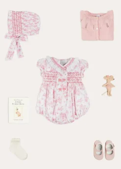 Lookbooks | Pepa London Audrey Hand Smocked Double Breasted Short Sleeve Romper in Pink (6mths-2yrs) | Audrey Toile Hand Smocked Bonnet in Pink (S-M) | Openwork Cotton Cardigan in Pink (6mths-10yrs) | Mary Jane Pram Shoes in Pink (17-20EU) | Openwork short socks White (0mths-8yrs)