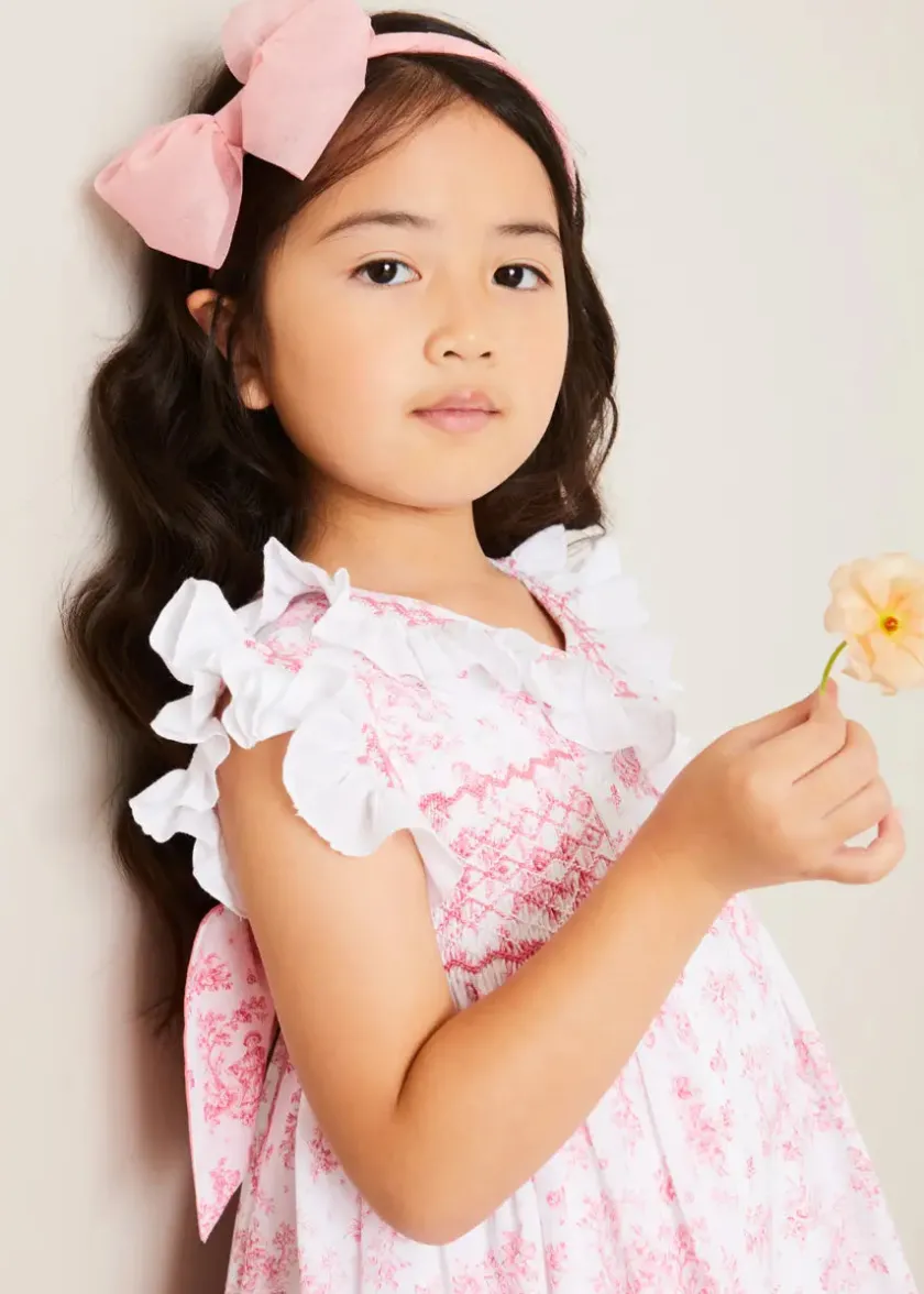 Lookbooks | Pepa London Audrey Toile Hand Smocked Double Breasted Sleeveless Dress in Pink (12mths-10yrs) | Peter Pan Collar Swing Coat in Pink (18mths-10yrs) | Openwork Cotton Cardigan in Cream (6mths-10yrs) | Leather Mary Jane Shoes in Pink (24-34EU) | Traditional Big Bow Tulle Hairband in Dusty Pink | Openwork short socks White (0mths-8yrs)