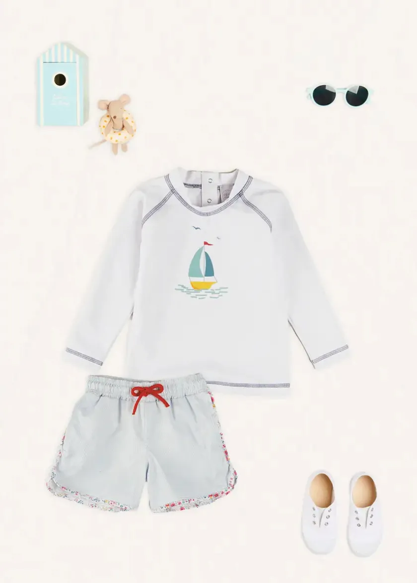 Lookbooks | Pepa London Boat Motif Long Sleeve Rashguard in Blue (2-6yrs) | Striped Contrast Trim Swim Shorts in Blue (2-10yrs) | Canvas Plimsolls in White (20-34EU) | Little Brother Beach Mouse Toy