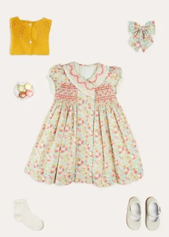 Lookbooks | Pepa London Clementine Floral Hand Smocked Double Breasted Short Sleeve Dress in Coral (12mths-10yrs) | Mary Jane Leather Baby Shoes in Ivory (20-24EU) | Clementine Floral Long Bow Hair Clip in Coral | Openwork short socks White (0mths-8yrs)