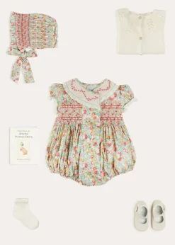 Lookbooks | Pepa London Clementine Floral Hand Smocked Double Breasted Short Sleeve Romper in Coral (6mths-3yrs) | Clementine Floral Hand Smocked Bonnet in Coral (S-M) | Openwork Cotton Cardigan in Cream (6mths-10yrs) | Leather Mary Jane Pram Shoes in Ivory (17-20EU) | Openwork short socks White (0mths-8yrs)