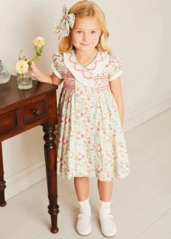 Lookbooks | Pepa London Clementine Floral Hand Smocked Double Breasted Short Sleeve Dress in Coral (12mths-10yrs) | Mary Jane Leather Baby Shoes in Ivory (20-24EU) | Clementine Floral Long Bow Hair Clip in Coral | Openwork short socks White (0mths-8yrs)