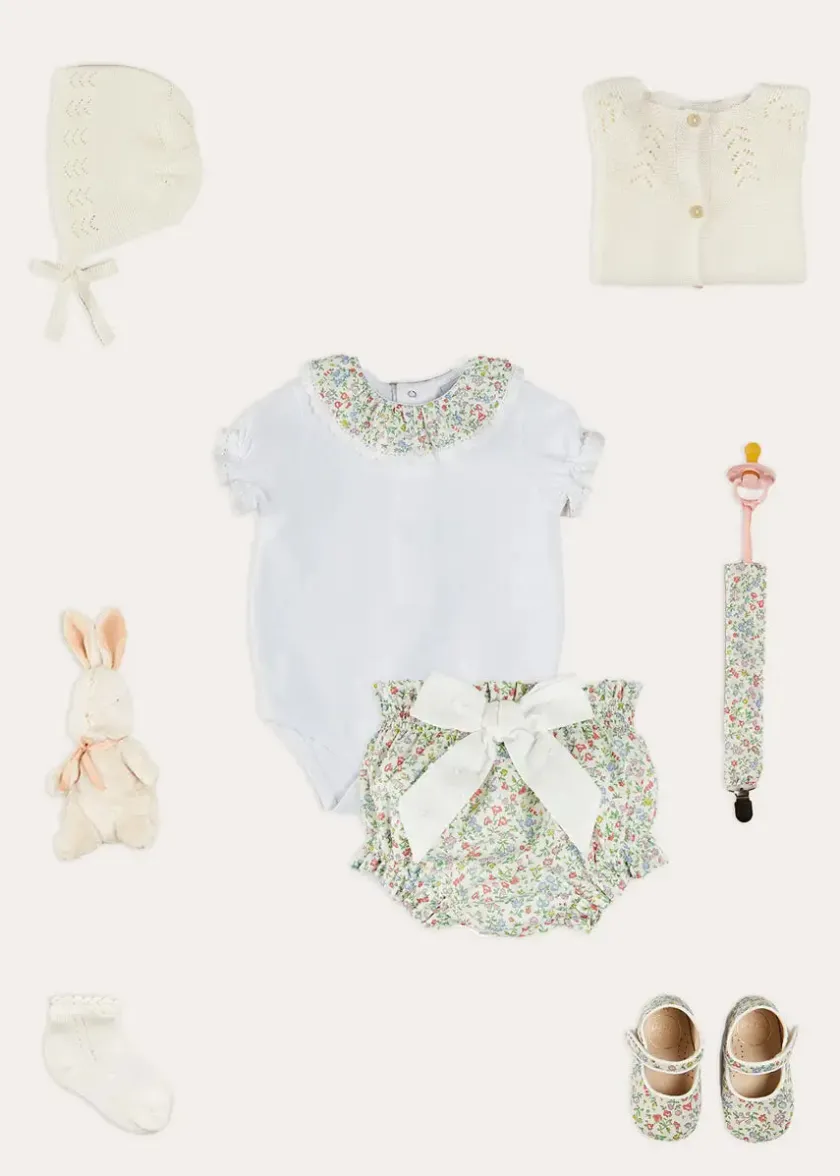 Lookbooks | Pepa London Cordelia Embroidered Double Collar Bodysuit in Pink Made with Liberty Fabric (1m-3yrs) | Cordelia Floral Bloomer with Bow in Pink Made with Liberty Fabric (1m-2yrs) | Openwork Cotton Cardigan in Cream (6mths-10yrs) | Openwork Cotton Knitted Bonnet in Cream (S-L) | Cordelia Liberty Floral Mary Jane Pram Shoes in Pink (17-20EU) | Cordelia Liberty Floral Dummy Clip in Pink | Openwork short socks White (0mths-8yrs)