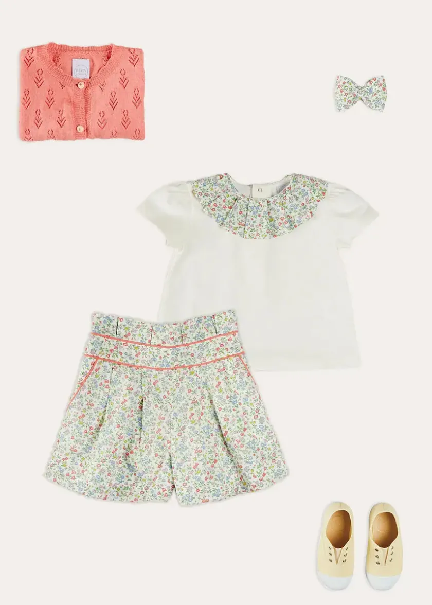 Lookbooks | Pepa London Cordelia Floral Collar Top in Pink Made with Liberty Fabric (2-10yrs) | Cordelia Floral Shorts in Pink Made with Liberty Fabric (4-10yrs) | Floral Openwork Cotton Cardigan in Pink (2-10yrs) | Canvas Plimsolls in Cream (20-35EU) | Cordelia Floral Medium Bow Clip in Pink Made with Liberty Fabric
