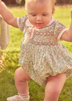 Rompers | Rompers | Pepa London Cordelia Floral Hand-Smocked Short Sleeve Romper in Pink Made with Liberty Fabric (3m-2yrs)
