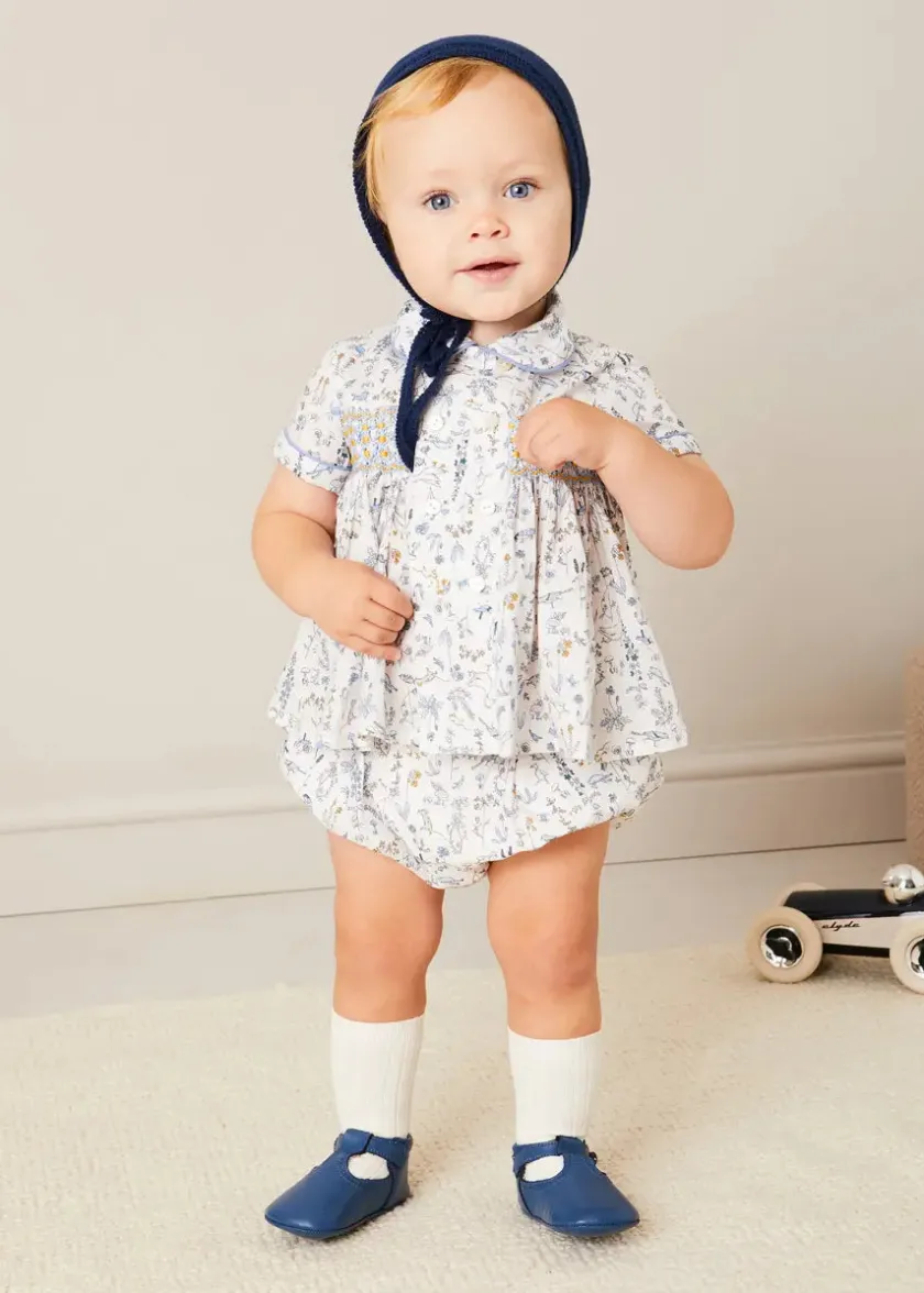 Lookbooks | Pepa London Ellis Liberty Print Hand Smocked Short Sleeve Shirt in Blue (6mths-4yrs) | Ellis Floral Bloomer in Blue Made with Liberty Fabric (1m-3yrs) | Plain Cardigan in Navy (6mths-10yrs) | Openwork Knitted Bonnet in Navy (S-L) | Leather T-Bar Pram Shoes in Classic Blue (17-20EU) | Ribbed Short Socks - Cream (0mths-10yrs)