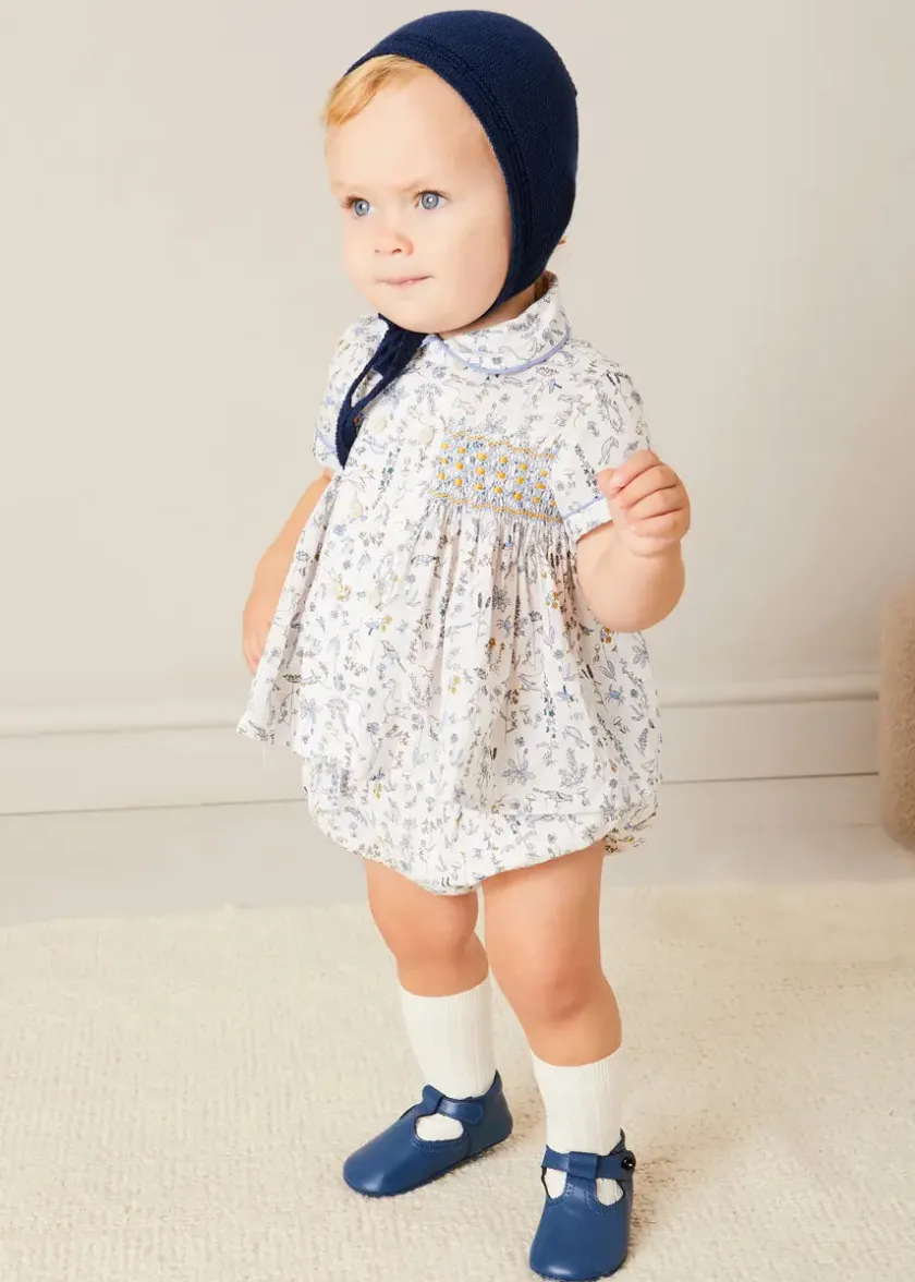 Lookbooks | Pepa London Ellis Liberty Print Hand Smocked Short Sleeve Shirt in Blue (6mths-4yrs) | Ellis Floral Bloomer in Blue Made with Liberty Fabric (1m-3yrs) | Plain Cardigan in Navy (6mths-10yrs) | Openwork Knitted Bonnet in Navy (S-L) | Leather T-Bar Pram Shoes in Classic Blue (17-20EU) | Ribbed Short Socks - Cream (0mths-10yrs)