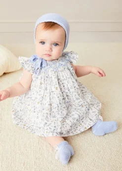 Lookbooks | Pepa London Ellis Sleeveless Dress with Bloomer and Bows in Blue Made with Liberty Fabric (1-12m) | Openwork Detail Baby Cardigan in Blue (1-12mths) | Lace Detail Knitted Bonnet in Blue (1-6mths) | Lace Detail Knitted Booties in Blue | Ellis Dummy Clip in Blue Made with Liberty Fabric | BIBS Dummy in Blue