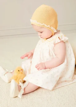 Lookbooks | Pepa London Esme Floral Hand Smocked Sleeveless Dress With Bloomers in White (1-12mths) | Openwork Detail Cotton Baby Cardigan in Tangerine (1-12mths) | Lace Detail Knitted Bonnet in Tangerine (1-12mths) | Celebration Ribbon Detail Mary Jane Pram Shoes in Beige (17-20EU) | Esme Floral Dummy Clip in White | Openwork short socks White (0mths-8yrs) | Chick Toy in Yellow