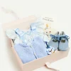 Curated Gift Boxes | Pepa London Gift boxes | Openwork Detail Baby Cardigan in Blue (1-12mths) | Suede Velvet Ribbon Pram Shoes in Blue (17-21 EU) | White Mouse Toy | BIBS Dummy in Blue