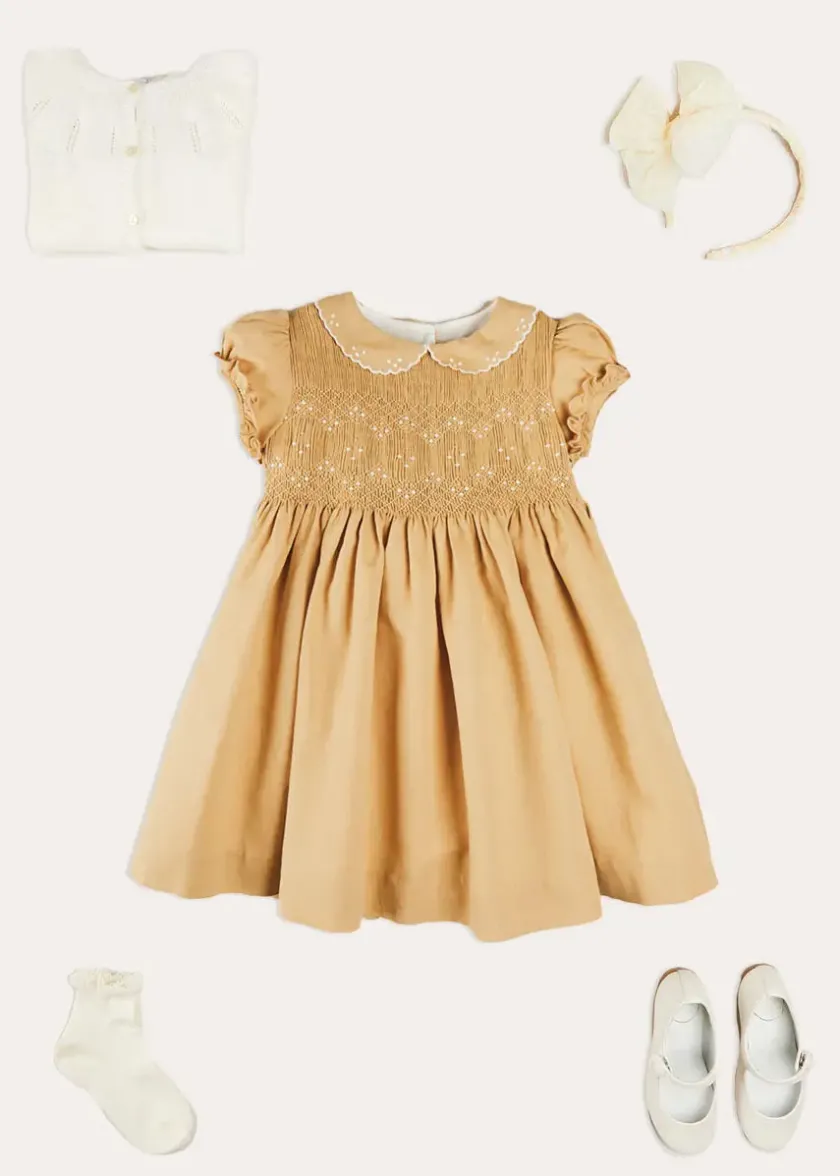 Lookbooks | Pepa London Hand Smocked Peter Pan Collar Short Sleeve Dress in Beige (12mths-10yrs) | Openwork Cotton Cardigan in Cream (6mths-10yrs) | Girls Ivory Leather Mary Jane Shoes (20-34EU) | Traditional Big Bow Tulle Hairband in Ivory | Celebration Short Socks with Ruffle- Cream (0mths-10yrs) | Tulle Long Bow Clip In Cream