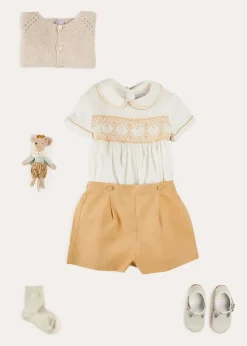 Lookbooks | Pepa London Hand Smocked Peter Pan Collar Short Sleeve Two Piece Set in Beige (18mths-6yrs) | Plain Cardigan in Cream (6mths-10yrs) | T-Bar Leather Baby Shoes in Ivory (20-24EU) | Cotton Short Socks Cream (0mths-10yrs)