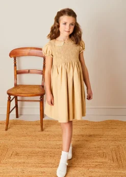 Lookbooks | Pepa London Hand Smocked Peter Pan Collar Short Sleeve Dress in Beige (12mths-10yrs) | Openwork Cotton Cardigan in Cream (6mths-10yrs) | Girls Ivory Leather Mary Jane Shoes (20-34EU) | Traditional Big Bow Tulle Hairband in Ivory | Celebration Short Socks with Ruffle- Cream (0mths-10yrs) | Tulle Long Bow Clip In Cream