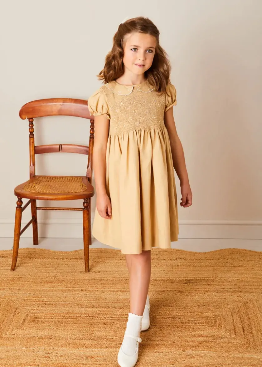 Lookbooks | Pepa London Hand Smocked Peter Pan Collar Short Sleeve Dress in Beige (12mths-10yrs) | Openwork Cotton Cardigan in Cream (6mths-10yrs) | Girls Ivory Leather Mary Jane Shoes (20-34EU) | Traditional Big Bow Tulle Hairband in Ivory | Celebration Short Socks with Ruffle- Cream (0mths-10yrs) | Tulle Long Bow Clip In Cream