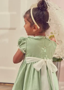 Lookbooks | Pepa London Hand Smocked Peter Pan Collar Short Sleeve Dress in Green (12mths-10yrs) | Openwork Cotton Cardigan in Cream (6mths-10yrs) | Girls Ivory Leather Mary Jane Shoes (20-34EU) | Traditional Big Bow Tulle Hairband in Ivory | Flower Fairies of the Spring Book in White | Openwork short socks White (0mths-8yrs)