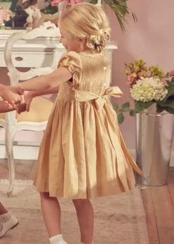 Lookbooks | Pepa London Hand Smocked Peter Pan Collar Short Sleeve Dress in Beige (12mths-10yrs) | Openwork Cotton Cardigan in Cream (6mths-10yrs) | Mary Jane Leather Baby Shoes in Ivory (20-24EU) | Traditional Big Bow Tulle Hairband in Ivory | Celebration Short Socks with Ruffle- Cream (0mths-10yrs)
