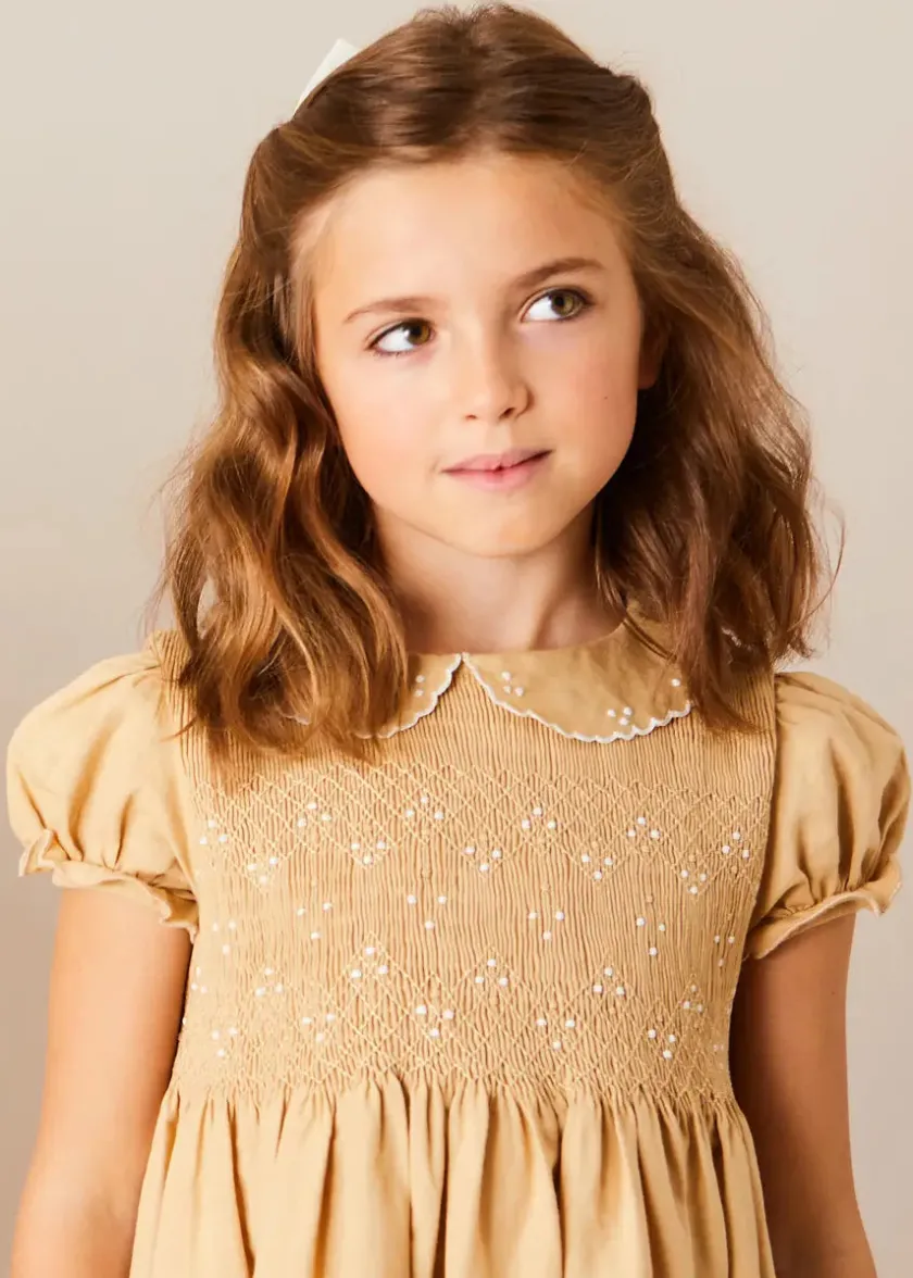 Lookbooks | Pepa London Hand Smocked Peter Pan Collar Short Sleeve Dress in Beige (12mths-10yrs) | Openwork Cotton Cardigan in Cream (6mths-10yrs) | Girls Ivory Leather Mary Jane Shoes (20-34EU) | Traditional Big Bow Tulle Hairband in Ivory | Celebration Short Socks with Ruffle- Cream (0mths-10yrs) | Tulle Long Bow Clip In Cream