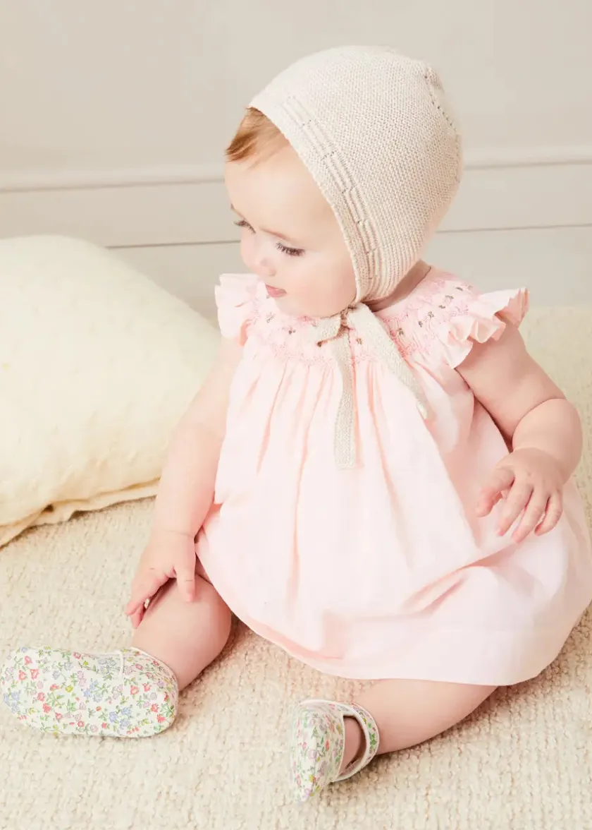 Lookbooks | Pepa London Hand Smocked Sleeveless Dress With Bloomers in Pink (1-12mths) | Openwork Detail Baby Cardigan in Pink (1-12mths) | Openwork Knitted Bonnet in Beige(S-L) | Cordelia Liberty Floral Mary Jane Pram Shoes in Pink (17-20EU) | Cordelia Liberty Floral Dummy Clip in Pink | Knitted Bunny Teether in Beige | BIBS Dummy in Pink