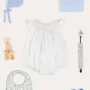 Lookbooks | Pepa London Hand Smocked Sleeveless Romper in White (3-18mths) | Openwork Detail Baby Cardigan in Blue (1-12mths) | Lace Detail Knitted Bonnet in Blue (1-6mths) | Ellis Rounded Bib with Embroidery in Blue Made with Liberty Fabric | Lace Detail Knitted Booties in Blue | Ellis Dummy Clip in Blue Made with Liberty Fabric | My First Bunny in a Box - Blue