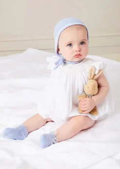 Lookbooks | Pepa London Hand Smocked Sleeveless Romper in White (3-18mths) | Openwork Detail Baby Cardigan in Blue (1-12mths) | Lace Detail Knitted Bonnet in Blue (1-6mths) | Ellis Rounded Bib with Embroidery in Blue Made with Liberty Fabric | Lace Detail Knitted Booties in Blue | Ellis Dummy Clip in Blue Made with Liberty Fabric | My First Bunny in a Box - Blue