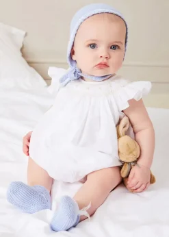 Lookbooks | Pepa London Hand Smocked Sleeveless Romper in White (3-18mths) | Openwork Detail Baby Cardigan in Blue (1-12mths) | Lace Detail Knitted Bonnet in Blue (1-6mths) | Ellis Rounded Bib with Embroidery in Blue Made with Liberty Fabric | Lace Detail Knitted Booties in Blue | Ellis Dummy Clip in Blue Made with Liberty Fabric | My First Bunny in a Box - Blue