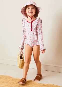 Lookbooks | Pepa London Louisa Floral Ruffle Trim Long Sleeve Swimsuit in Pink (2-10yrs) | Louisa Floral Beach Hat in Pink (S-M) | Open Toe Leather Sandals in Brown (17-30EU) | Louisa Floral Detail Raffia Bag in Coral