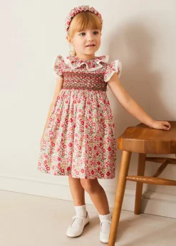 Lookbooks | Pepa London Margot Hand-Smocked Dress in Red Made with Liberty Fabric (12m-6yrs) | Openwork Cotton Cardigan in Cream (6mths-10yrs) | Mary Jane Leather Baby Shoes in Ivory (20-24EU) | Margot Liberty Floral Scrunchie Hairband in Red | Openwork short socks White (0mths-8yrs)