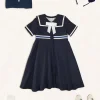 Lookbooks | Pepa London Mariner Collar Bow Detail Short Sleeve Dress in Navy (4-12yrs) | Plain Cardigan in Navy (6mths-10yrs) | Girls Ivory Leather Mary Jane Shoes (20-34EU) | Navy Linen Big Bow Hairband | Cotton Short Socks Cream (0mths-10yrs)
