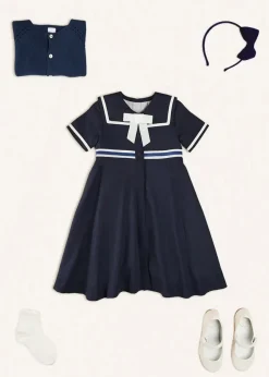 Lookbooks | Pepa London Mariner Collar Bow Detail Short Sleeve Dress in Navy (4-12yrs) | Plain Cardigan in Navy (6mths-10yrs) | Girls Ivory Leather Mary Jane Shoes (20-34EU) | Navy Linen Big Bow Hairband | Cotton Short Socks Cream (0mths-10yrs)