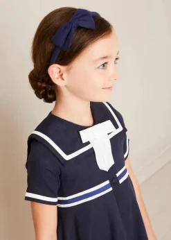 Lookbooks | Pepa London Mariner Collar Bow Detail Short Sleeve Dress in Navy (4-12yrs) | Plain Cardigan in Navy (6mths-10yrs) | Girls Ivory Leather Mary Jane Shoes (20-34EU) | Navy Linen Big Bow Hairband | Cotton Short Socks Cream (0mths-10yrs)