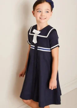 Lookbooks | Pepa London Mariner Collar Bow Detail Short Sleeve Dress in Navy (4-12yrs) | Plain Cardigan in Navy (6mths-10yrs) | Girls Ivory Leather Mary Jane Shoes (20-34EU) | Navy Linen Big Bow Hairband | Cotton Short Socks Cream (0mths-10yrs)