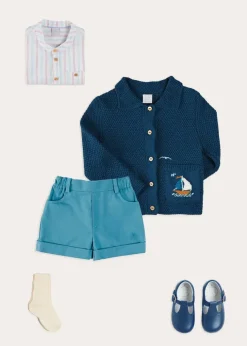 Lookbooks | Pepa London Nautical Boat Embroidery Polo Collar Cardigan in Blue (12mths-6yrs) | Chesham Striped Mao Collar Long Sleeve Shirt in Red (3-10yrs) | Plain Elasticated Shorts in Blue (12mths-4yrs) | T-Bar Baby Shoes in Blue (20-26EU) | Ribbed Short Socks in Beige (0mths-10yrs)