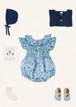 Lookbooks | Pepa London Olivia Floral Smocked Ruffle Collar Sleeveless Romper in Blue (6mths-2yrs) | Plain Cardigan in Navy (6mths-10yrs) | Openwork Knitted Bonnet in Navy (S-L) | Olivia Floral Mary Jane Pram Shoes in Blue (17-20EU) | Openwork short socks White (0mths-8yrs) | Flower Fairies of the Summer Book in White
