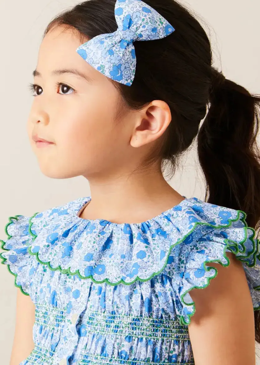 Lookbooks | Pepa London Olivia Floral Smocked Ruffle Collar Sleeveless Dress in Blue (12mths-10yrs) | Floral Openwork Cotton Cardigan in Green (2-10yrs) | Leather Woven Detail Sandals in Beige (24-35EU) | Olivia Floral Medium Bow Hair Clip in Blue