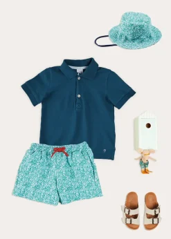Lookbooks | Pepa London Plain Short Sleeve Polo Shirt in Navy (2-10yrs) | Adelaide Floral Tie Detail Swim Shorts in Green (2-10yrs) | Suede Buckle Detail Sandals in Beige (28-35EU) | Adelaide Floral Beach Hat in Green (S-M) | Big Brother Beach Mouse Toy
