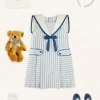 Lookbooks | Pepa London Regency Striped Mariner Collar Pleated Sleeveless Dress in Blue (2-10yrs) | Openwork Cotton Cardigan in Cream (6mths-10yrs) | Limited Edition Merrythought & Pepa Teddy Bear With Regency Striped Bow in Blue (S-L) | Blue Linen Big Bow Hairband | Openwork short socks White (0mths-8yrs)