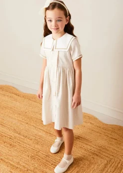 Lookbooks | Pepa London Waterford Striped Mariner Collar Double Breasted Short Sleeve Dress in Beige (12mths-10yrs) | Openwork Cotton Cardigan in Cream (6mths-10yrs) | Girl's Beige Leather Celebration Shoes (20-34EU) | Tulle Long Bow Clip In Cream | Cotton Short Socks Cream (0mths-10yrs)