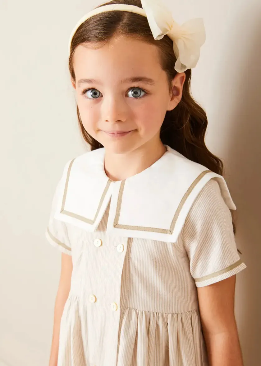Lookbooks | Pepa London Waterford Striped Mariner Collar Double Breasted Short Sleeve Dress in Beige (12mths-10yrs) | Openwork Cotton Cardigan in Cream (6mths-10yrs) | Girl's Beige Leather Celebration Shoes (20-34EU) | Tulle Long Bow Clip In Cream | Cotton Short Socks Cream (0mths-10yrs)